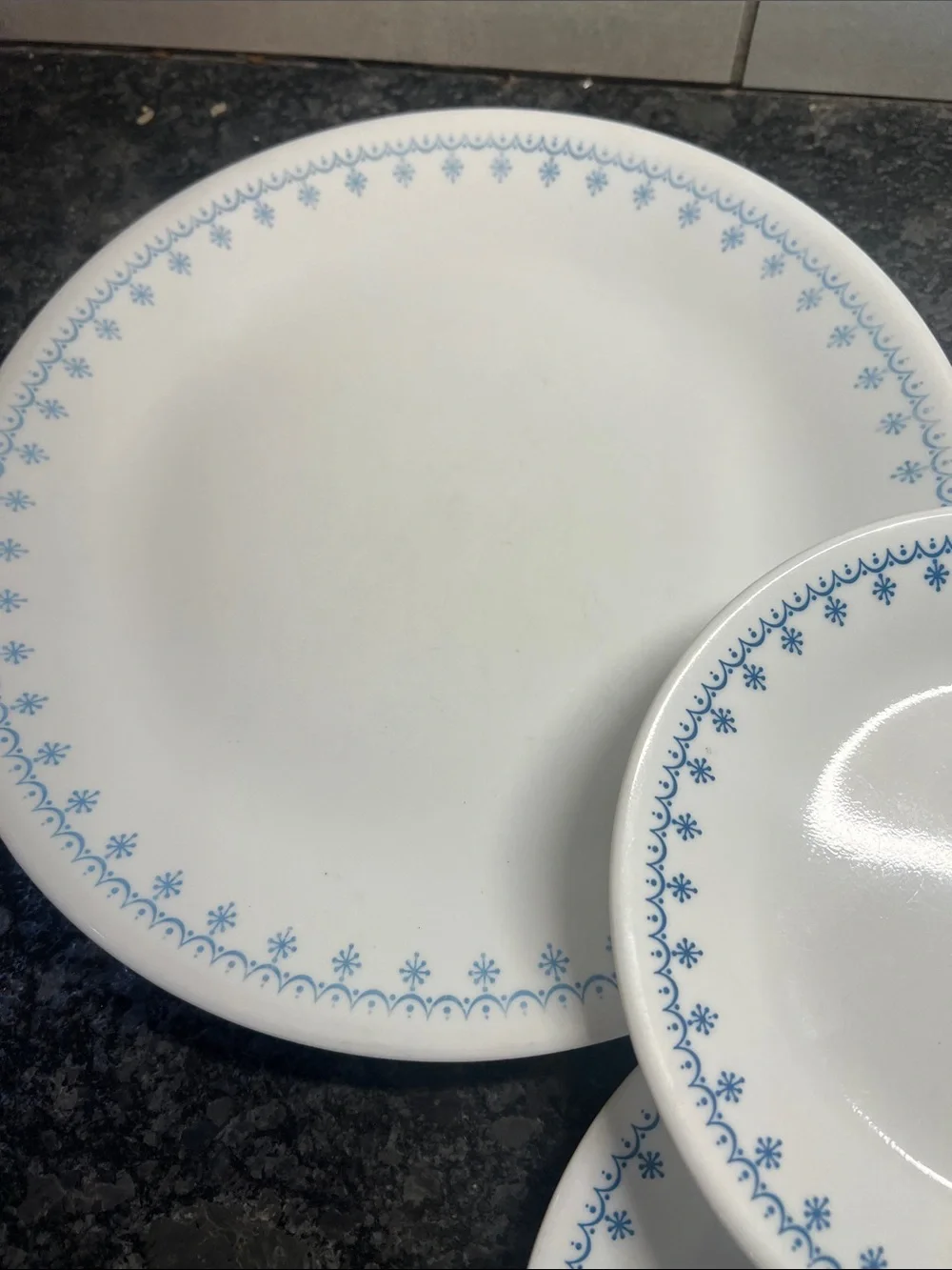 4 piece set of Corelle Dinner plates and salad plates. Snowflake Blue